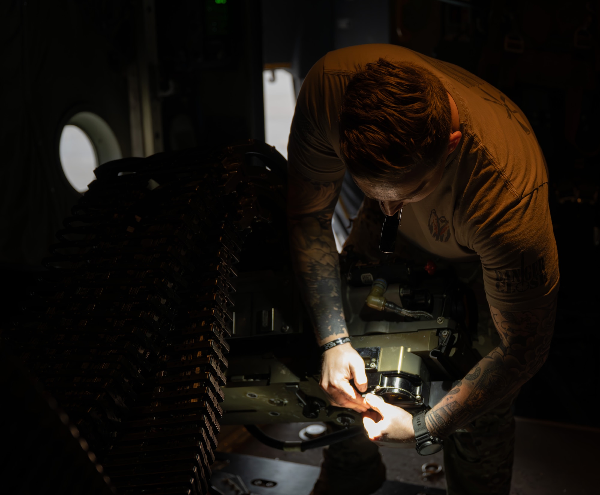 A U.S. Air Commando assigned to the 1st Special Operations Wing conducts pre-flight checks on a 30-mm cannon aboard an AC-130J Ghostrider gunship at Hurlburt Field, Florida, Nov. 12, 2025.