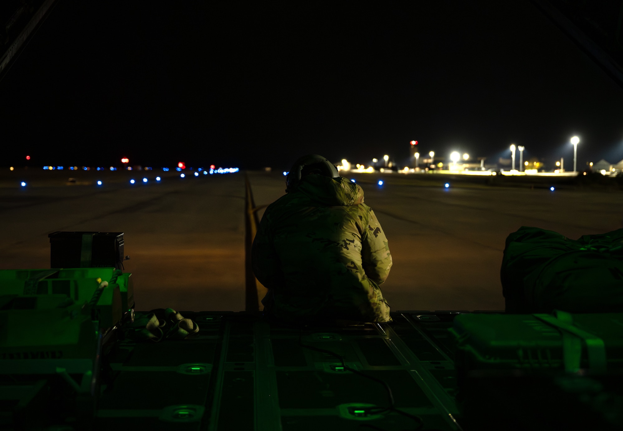 A U.S. Air Force special missions aviator assigned to the 1st Special Operations Wing sits on the rear door of an AC-130J Ghostrider gunship during a routine training mission at Hurlburt Field, Florida, Nov. 12, 2025.