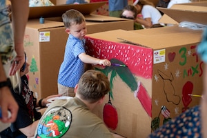 Service members and families decorate bundles
