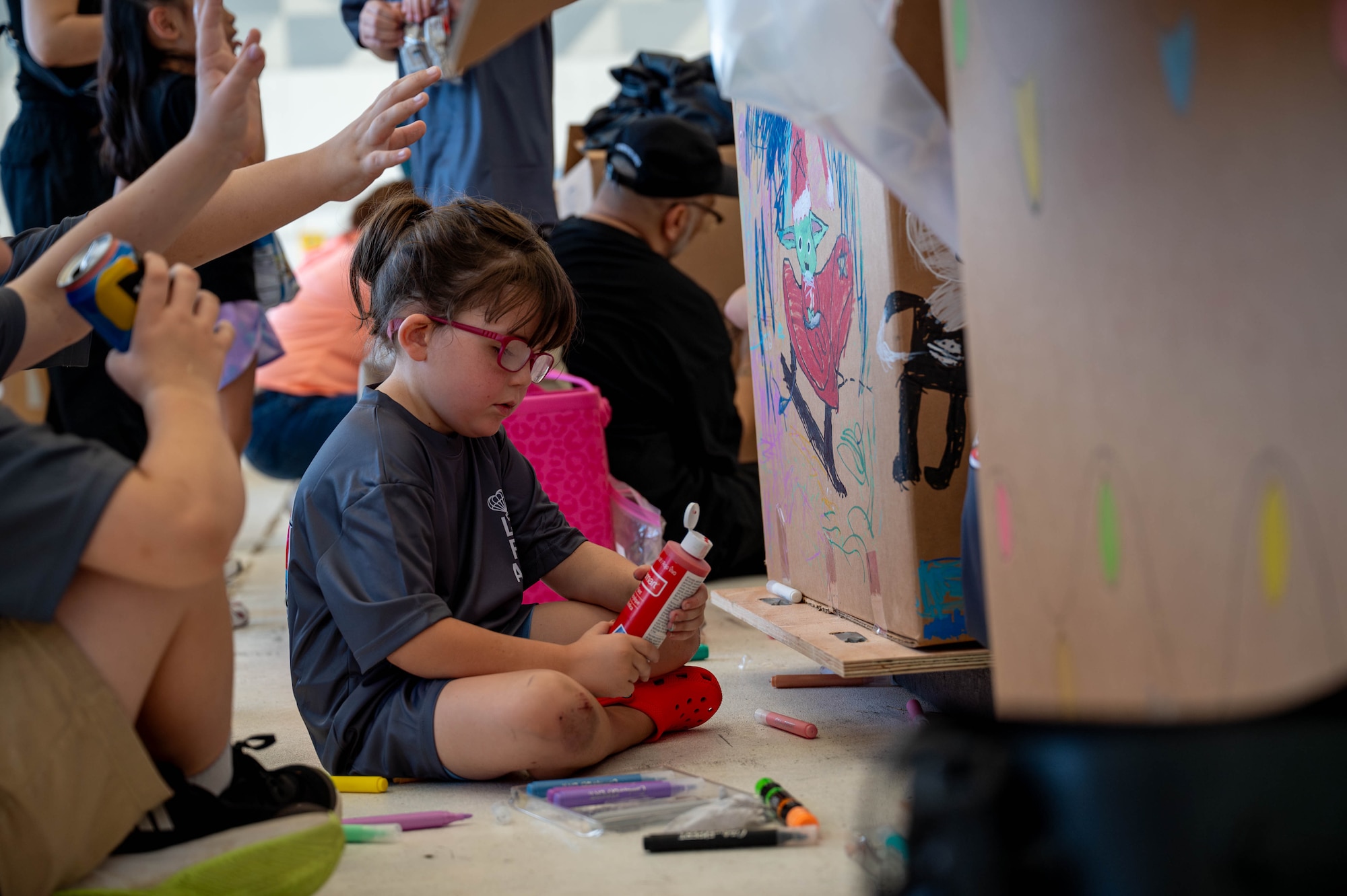 Service members decorate bundles.