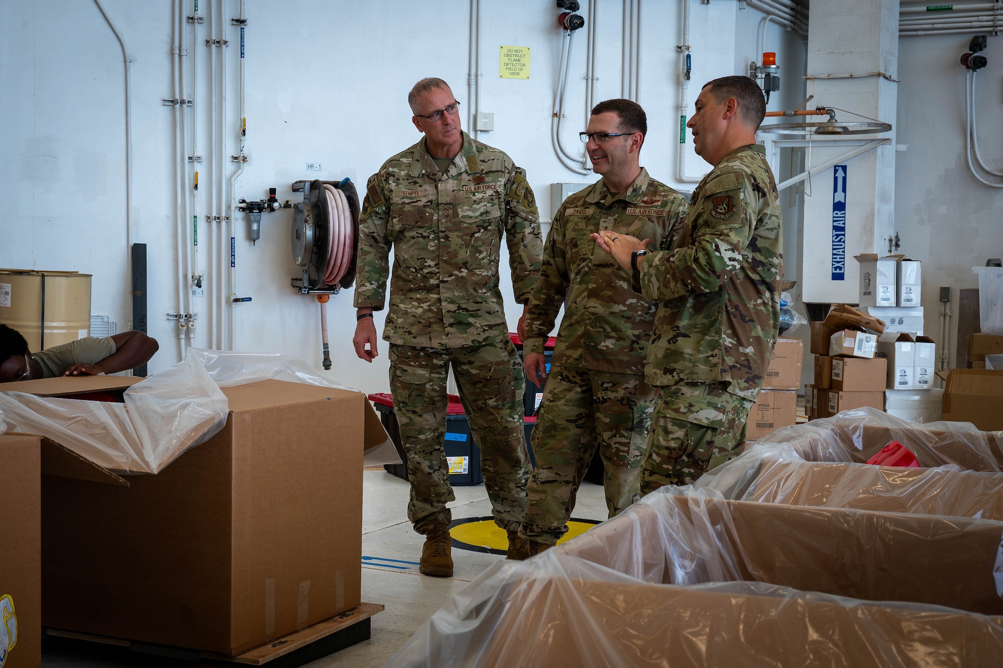 U.S. Air Force leadership observe bundle building and humanitarian efforts.