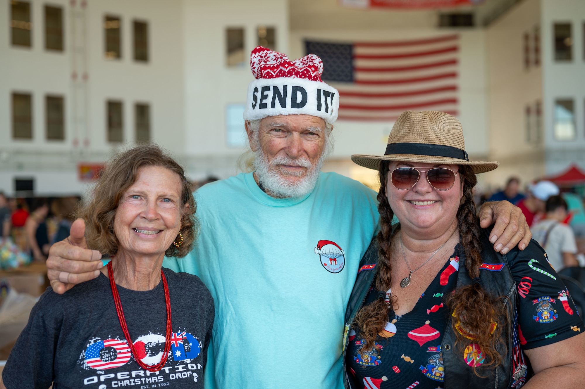 Brother Bruce and volunteers smile.