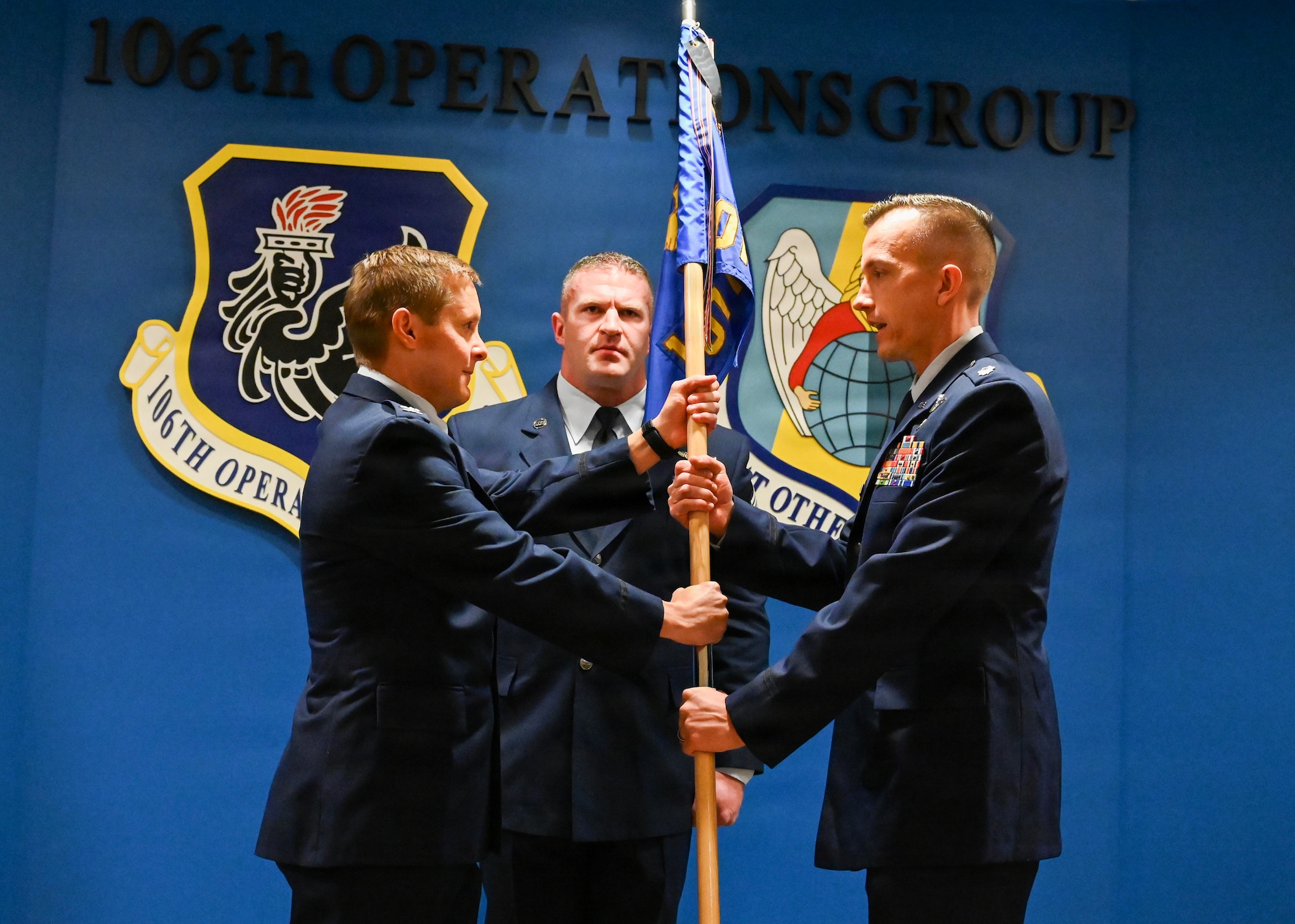 U.S. Air Force Lt. Col. James Liston, a 101st Rescue Squadron HH-60W Jolly Green II pilot, receives the 101st Rescue Squadron guidon from U.S. Air Force Col. Sean Garell, 106th Operations Group commander, during a Change of Command ceremony at the New York Air National Guard’s 106th Rescue Wing, Francis S. Gabreski Air National Guard Base, Westhampton Beach, N.Y., November 9, 2025.