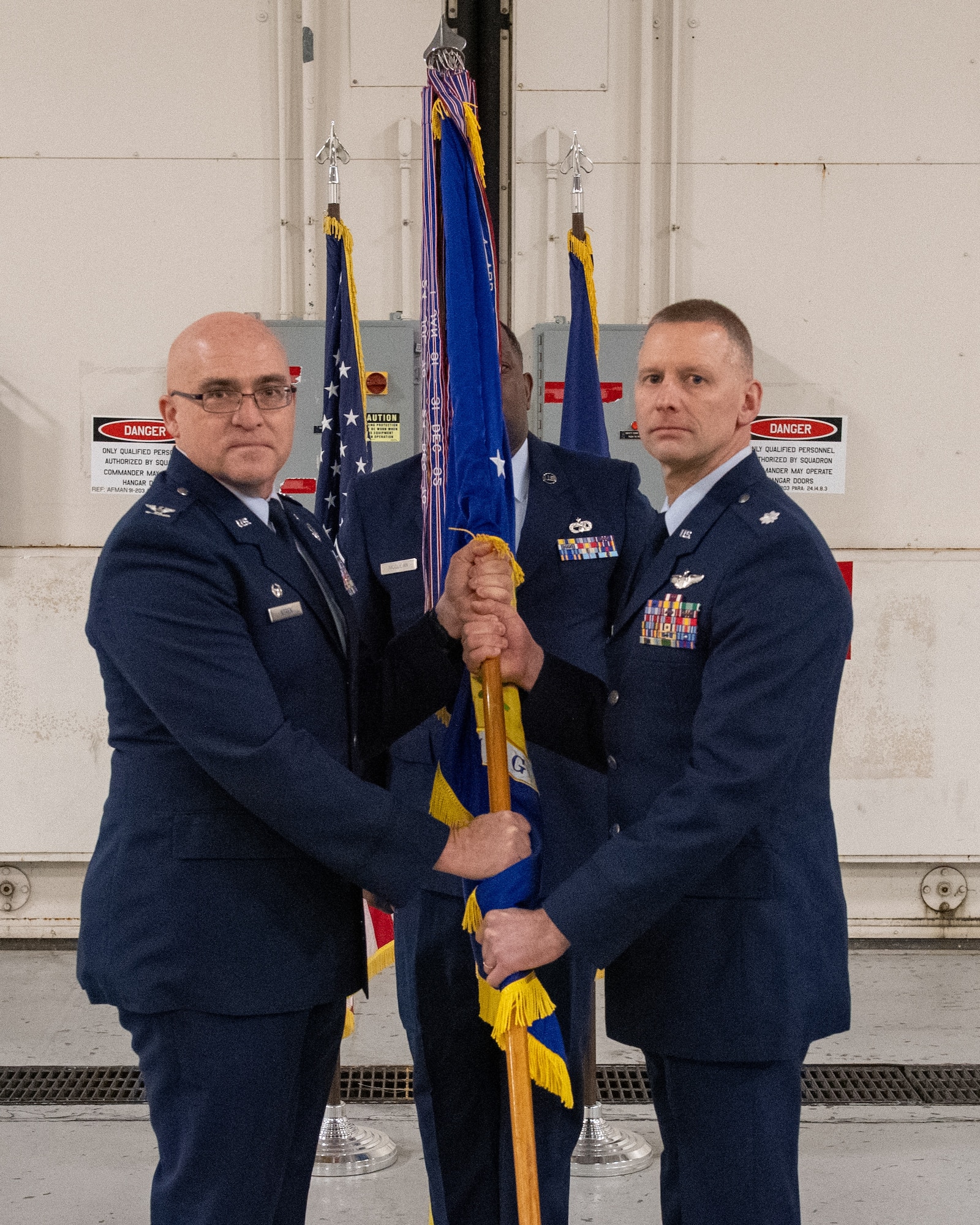 MIDDLETOWN, Pa – Lt Col. Lee Dewald (right) receives the guidon from Col. Robert Noren, 193rd Special Operations Wing commander, during a change of command ceremony for the 193rd Special Operations Mission Support Group in Middletown, Pa., Dec. 5, 2025.