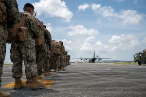 uniformed members line up to board an aircraft view from a low angle by the military boots