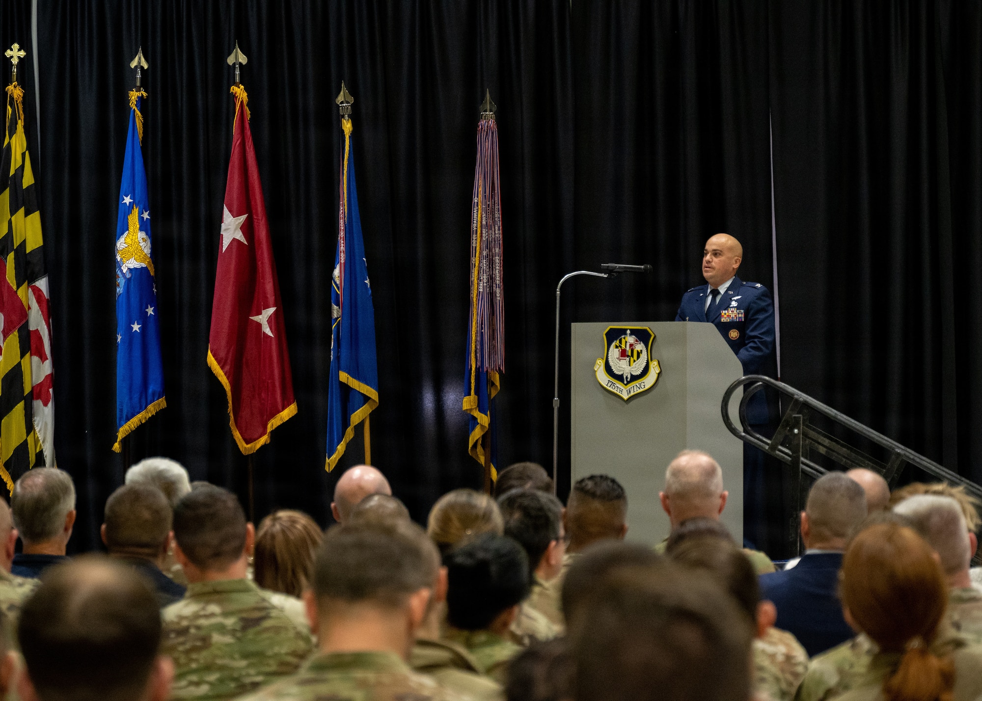 Maryland Air National Guard Col. Joed I. Carbonell, the new commander of the 175th Wing, speaks to members of the Maryland Air National Guard during the 175th Wing change of command ceremony, December 7, 2025, at Warfield Air National Guard Base at Martin State Airport, Middle River, Maryland. Carbonell comes to the 175th Wing from the 179th Cyberspace Operations Group at Mansfield Air National Guard Base, Ohio where he was the commander. (U.S. Air National Guard photo by Airman 1st Class Sarah Hoover)