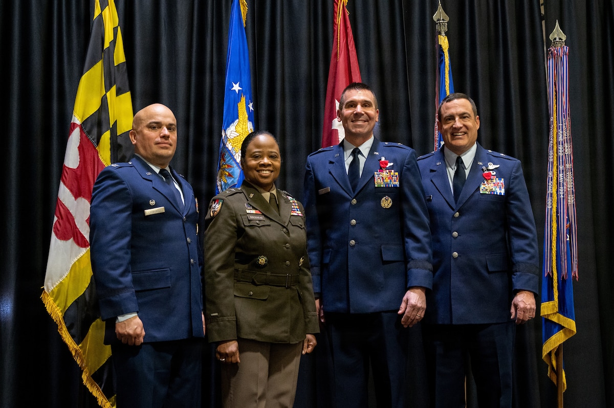 Maryland Air National Guard Col. Joed I. Carbonell, the new commander of the 175th Wing, Maryland Army National Guard Maj. Gen. Janeen L. Birckhead, adjutant general of Maryland, Maryland Air National Guard Brig. Gen. Drew E. Dougherty, previous commander of the Maryland Air National Guard, and Maryland Air National Guard Brig. Gen. Richard Hunt, interim Maryland Air National Guard commander, pose for a group photo during the 175th Wing and Maryland Air National Guard change of command ceremony, December 7, 2025, at Warfield Air National Guard Base at Martin State Airport, Middle River, Maryland. During this time of transition from a dual-mission set to a complete cyber focus, the role of leadership is of the utmost importance. (U.S. Air National Guard photo by Airman 1st Class Sarah Hoover)