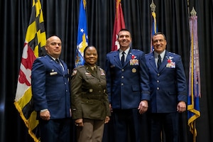 Maryland Air National Guard Col. Joed I. Carbonell, the new commander of the 175th Wing, Maryland Army National Guard Maj. Gen. Janeen L. Birckhead, adjutant general of Maryland, Maryland Air National Guard Brig. Gen. Drew E. Dougherty, previous commander of the Maryland Air National Guard, and Maryland Air National Guard Brig. Gen. Richard Hunt, interim Maryland Air National Guard commander, pose for a group photo during the 175th Wing and Maryland Air National Guard change of command ceremony, December 7, 2025, at Warfield Air National Guard Base at Martin State Airport, Middle River, Maryland. During this time of transition from a dual-mission set to a complete cyber focus, the role of leadership is of the utmost importance. (U.S. Air National Guard photo by Airman 1st Class Sarah Hoover)