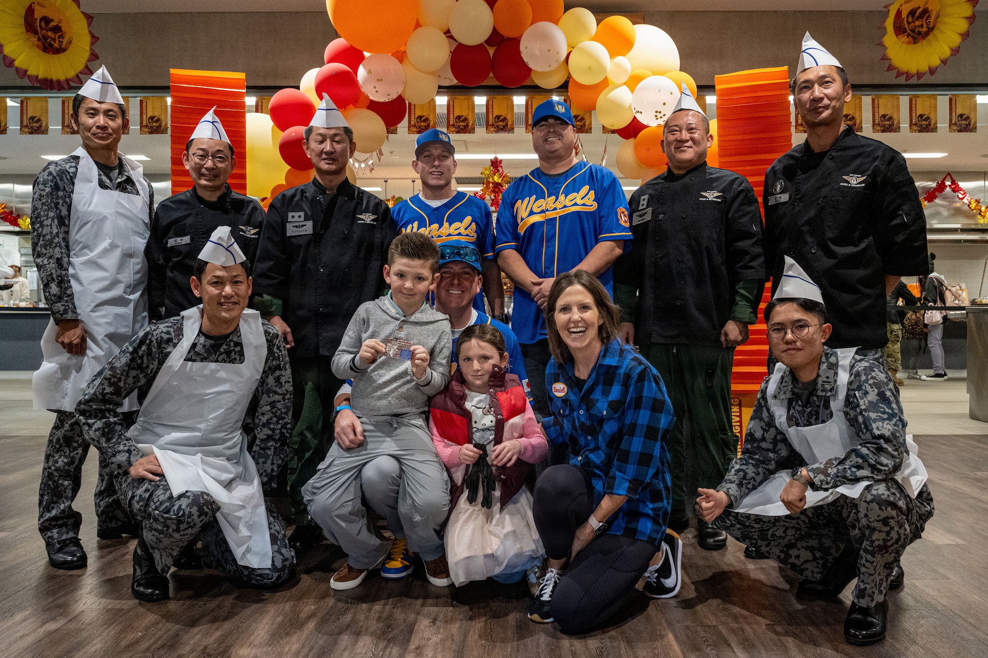 35th Fighter Wing (FW) and Japan Air Self-Defense Force (JASDF) 3rd Air Wing leaders pose for a photo during the Thanksgiving Holiday Meal.