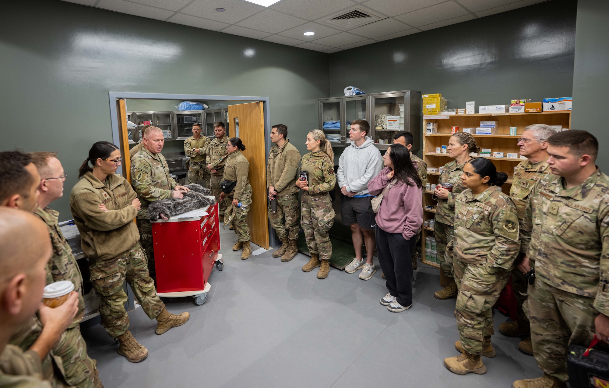 U.S. Army Lt. Col. Lance Kurz, 994th Medical Detachment veterinarian, shows Airmen assigned to the 332nd Expeditionary Medical Squadron how to perform canine Tactical Combat Casualty Care in the U.S. Central Command area of responsibility, Nov. 20, 2025.
