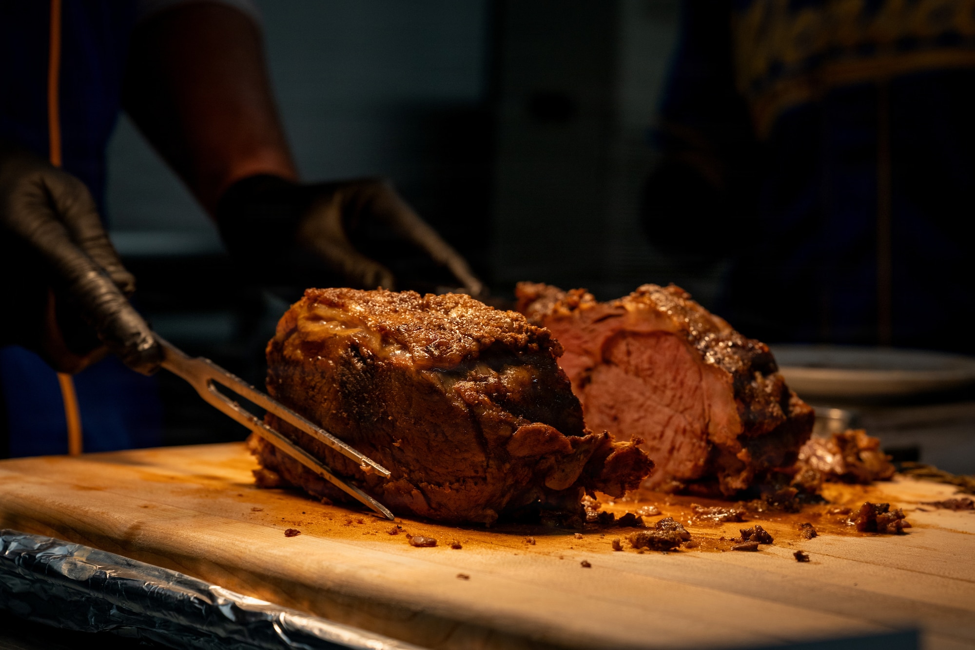 U.S. Air Force Col. Matthew Hoyt, 35th Fighter Wing (FW) deputy commander, serves food during the Thanksgiving Holiday Meal