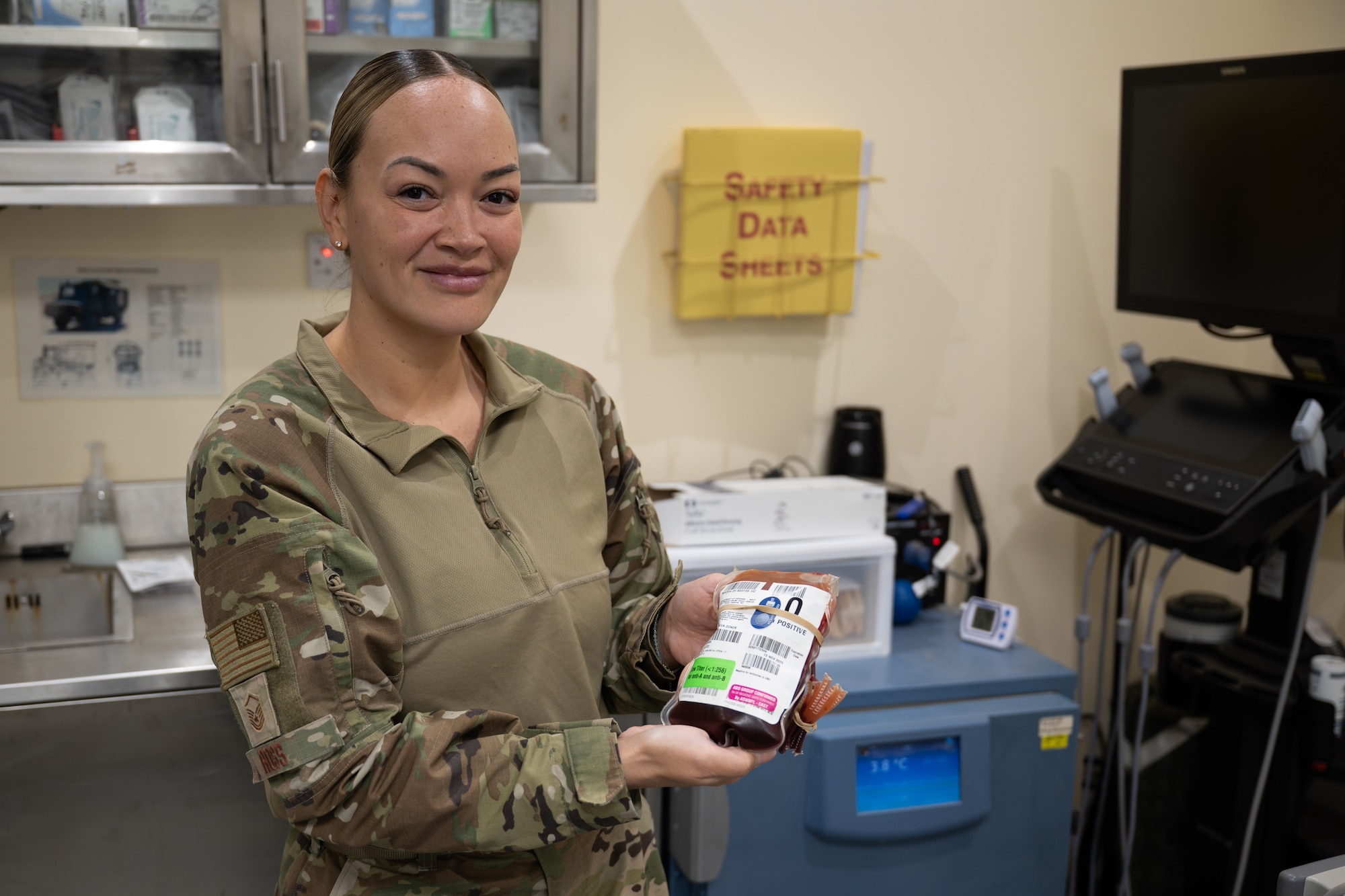 U.S. Air Force Master Sgt. Malissa Ross, 332nd Expeditionary Medical Squadron laboratory noncommissioned officer in charge, holds a container of blood in the U.S. Central Command area of responsibility, Nov. 13, 2025.