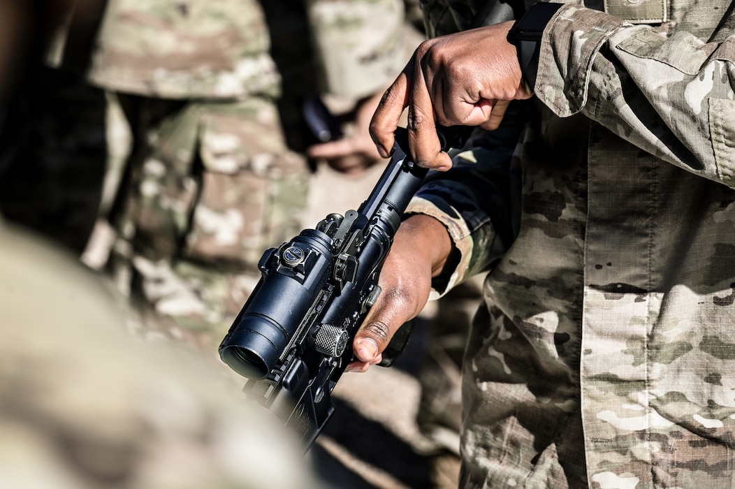 U.S. Air Force Airman 1st Class Bradley Taylor, 56th Civil Engineer Squadron water and fuel systems maintenance specialist, finishes assembling an M-4 Carbine during a timed challenge at the Prime Base Engineer Emergency Force readiness challenge