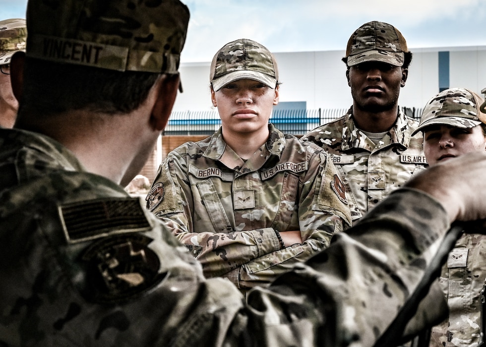 U.S. Air Force Airman 1st Class Alexis Berndt, 56th Civil Engineer Squadron electrical systems specialist, and her team receive instruction on operating Humvees during the Prime Base Engineer Emergency Force readiness challenge