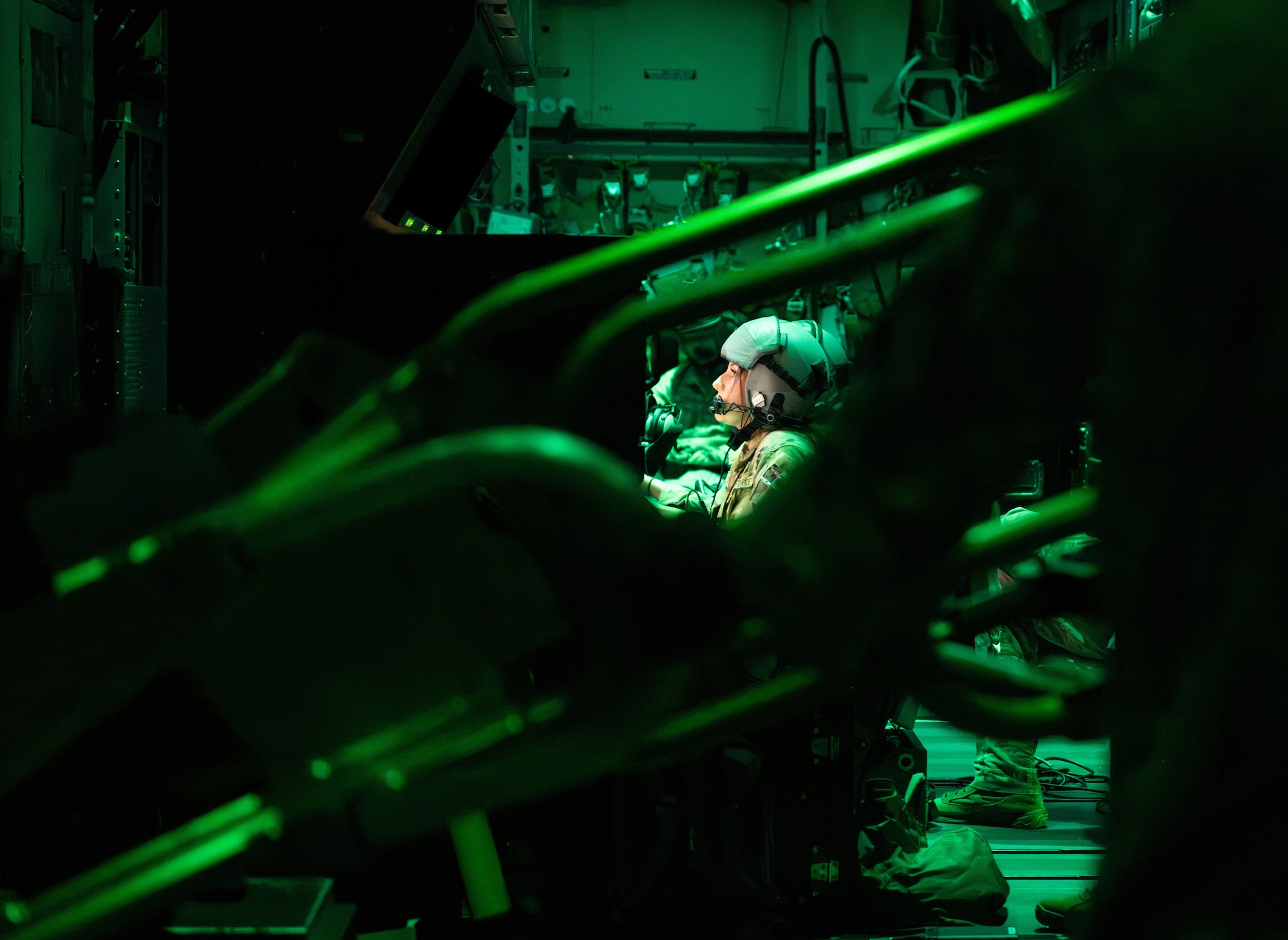 A U.S. Air Force AC-130J Ghostrider gunship weapons systems operator assigned to the 1st Special Operations Wing scans for targets above a range near Hurlburt Field, Florida, Nov. 12, 2025.
