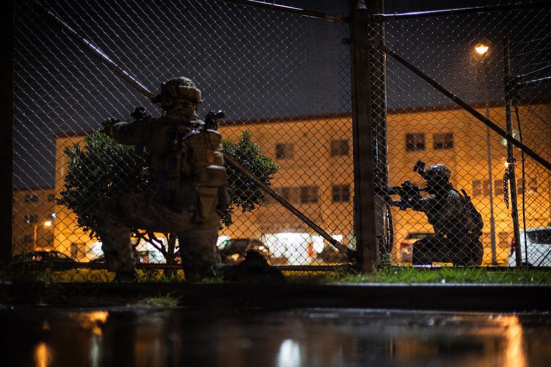 U.S. Marines with 3rd Reconnaissance Battalion, 3rd Marine Division, maintain security while exfiltrating from a simulated hostile environment during an Expeditionary Operations Training Group Close Quarters Tactics Course at Camp Hansen, Okinawa, Japan, Oct. 28, 2025.