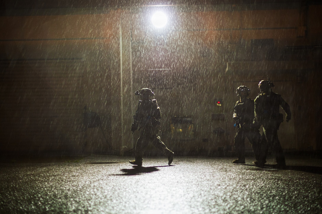 U.S. Marines with 3rd Reconnaissance Battalion, 3rd Marine Division, exfiltrate from a simulated hostile environment during an Expeditionary Operations Training Group Close Quarters Tactics Course at Camp Hansen, Okinawa, Japan, Oct. 28, 2025.