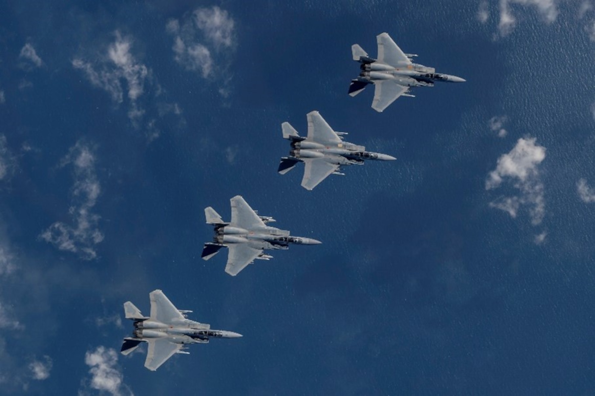 A formation of four U.S. Air Force F-15EX Eagle II fighter jets, assigned to Eglin Air Force Base, Florida, fly over the Gulf of America, Nov. 21, 2025. Secretary of the Air Force Troy Meink flew in the backseat of the lead jet as part of his visit to Eglin AFB. The flight oriented Meink to F-15EX tactics, techniques and procedures being developed and advanced by the 53d Wing to include weapons capacity, next-gen survivability, and next-generation radars, sensors and networking capabilities. (U.S. Air Force photo by Staff Sgt. Blake Wiles)