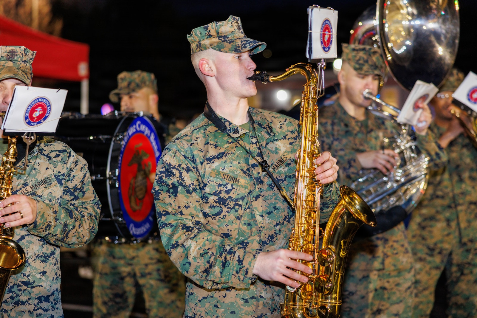 Santa takes a photo with a family during his visit to the holiday festival at Marine Corps Base Quantico, Dec. 4, 2025. The festival featured holiday crafts, a seasonal market with local vendors, food trucks, ice skating, snowball fights and photos with Santa. (U.S. Marine Corps photo by Lance Cpl. Federico Marquez)