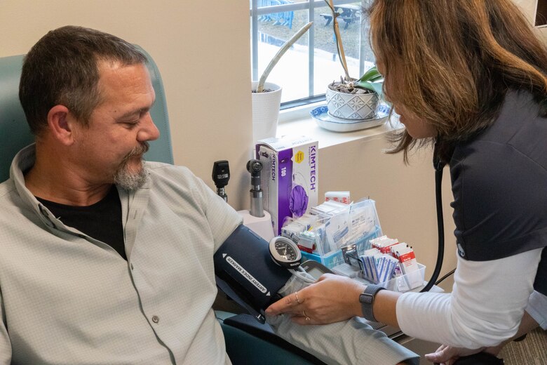 Emily Russell, an occupational health registered nurse (RN) with the U.S. Army Corps of Engineers (USACE) Charleston District checks in on a patient.