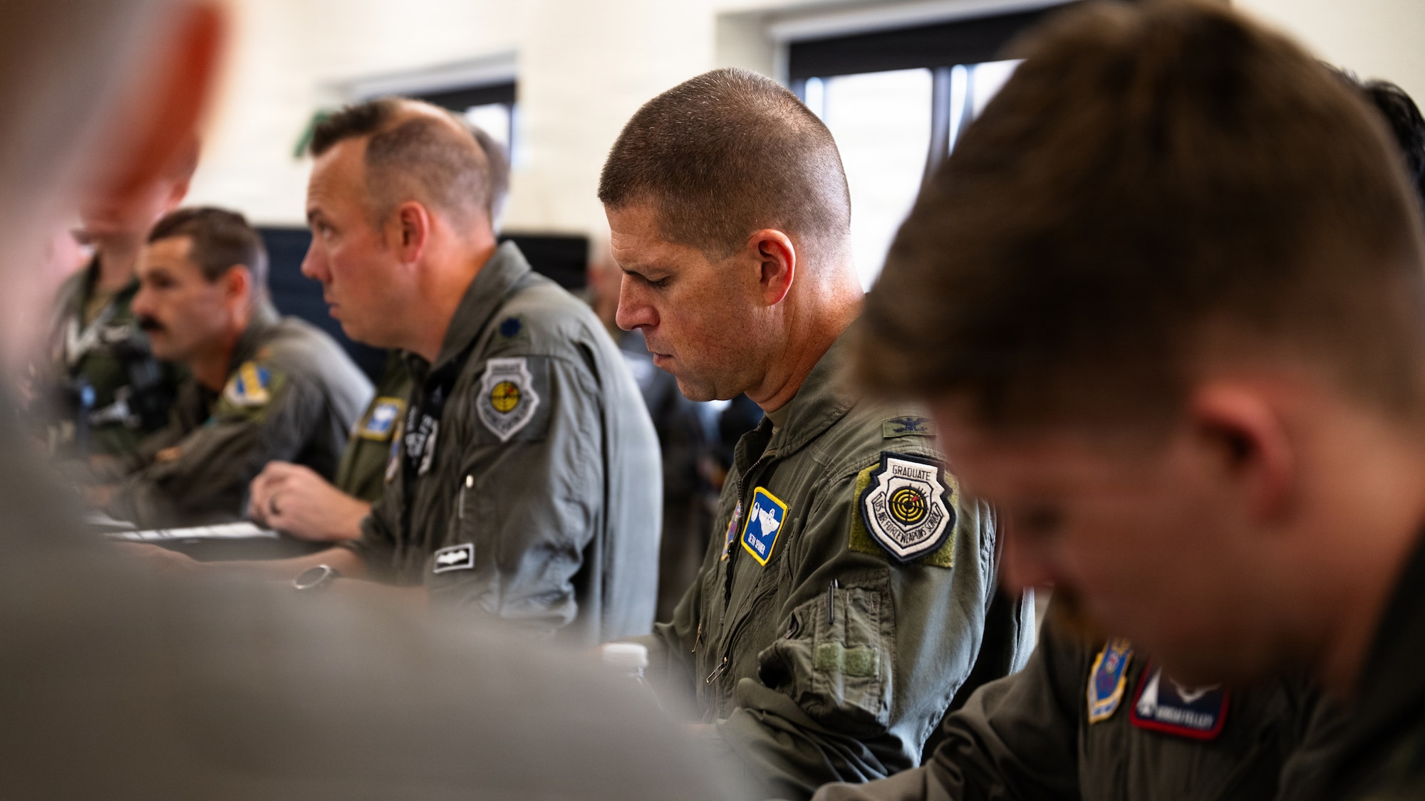 U.S. Air Force Col. Seth Spanier, 7th Bomb Wing commander and B-1B Lancer pilot, attends a mission brief before a routine training flight at Dyess Air Force Base, Texas, Sept. 15, 2025. Spanier is a command pilot with over 3,260 flight hours. (U.S. Air Force photo by Senior Airman Jade M. Caldwell)