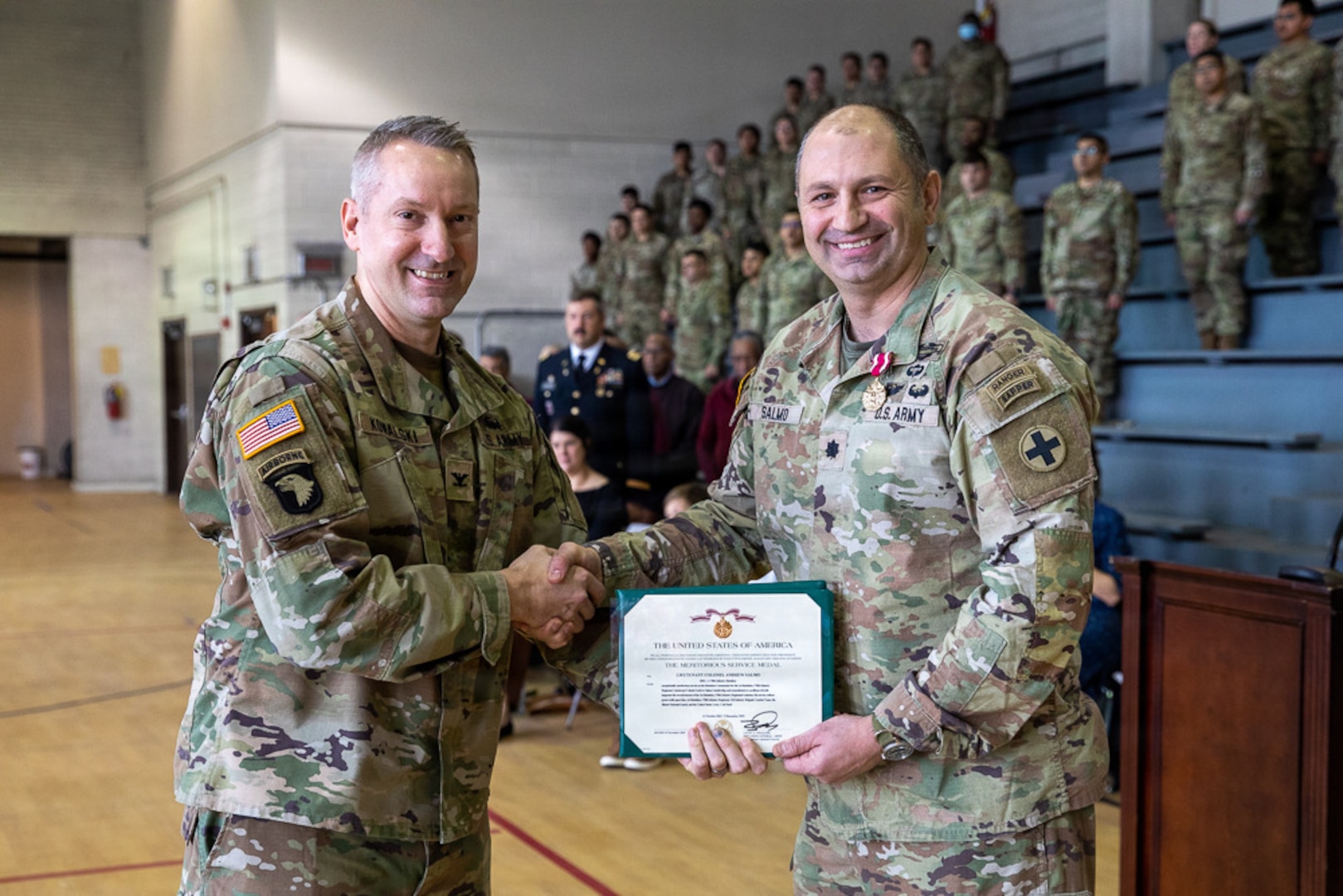Lt. Col. Andrew V. Salmo, outgoing commander of the 1st Battalion, 178th Infantry Regiment, receives the Meritorious Service Medal from Col. Michael Kowalski, commander of the 33rd Infantry Brigade Combat Team.