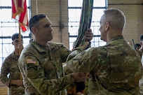 Lt. Col. John A. Christel, incoming commander of the 1st Battalion, 178th Infantry Regiment, receives the battalion guidon from Col. Michael Kowalski, commander of the 33rd Infantry Brigade Combat Team.