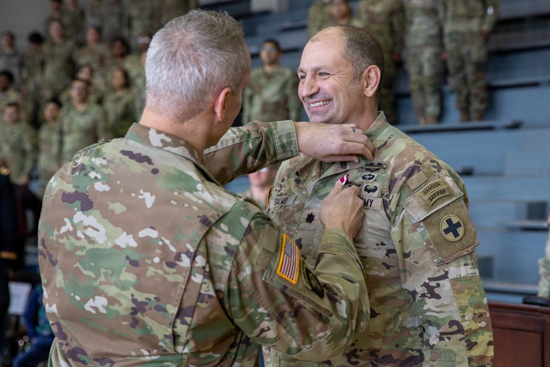 Lt. Col. Andrew V. Salmo receives the Meritorious Service Medal from Col. Michael Kowalski.