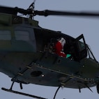Santa Clause riding a helocopter