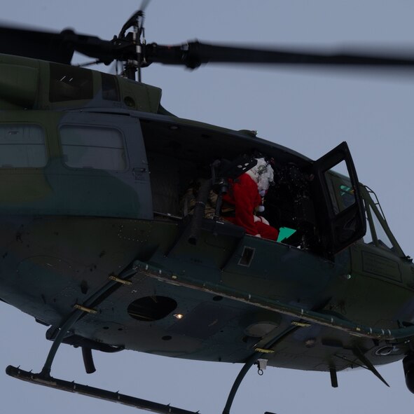 Santa Clause riding a helocopter
