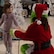 A child interacts with the grinch