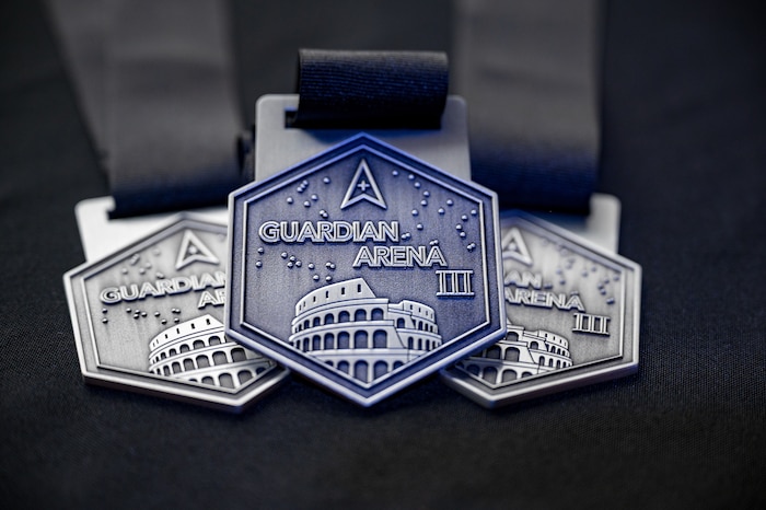 Guardian Arena medals are shown during the opening ceremony of the third annual Guardian Arena at Kennedy Space Center, Fla., Dec. 8, 2025.