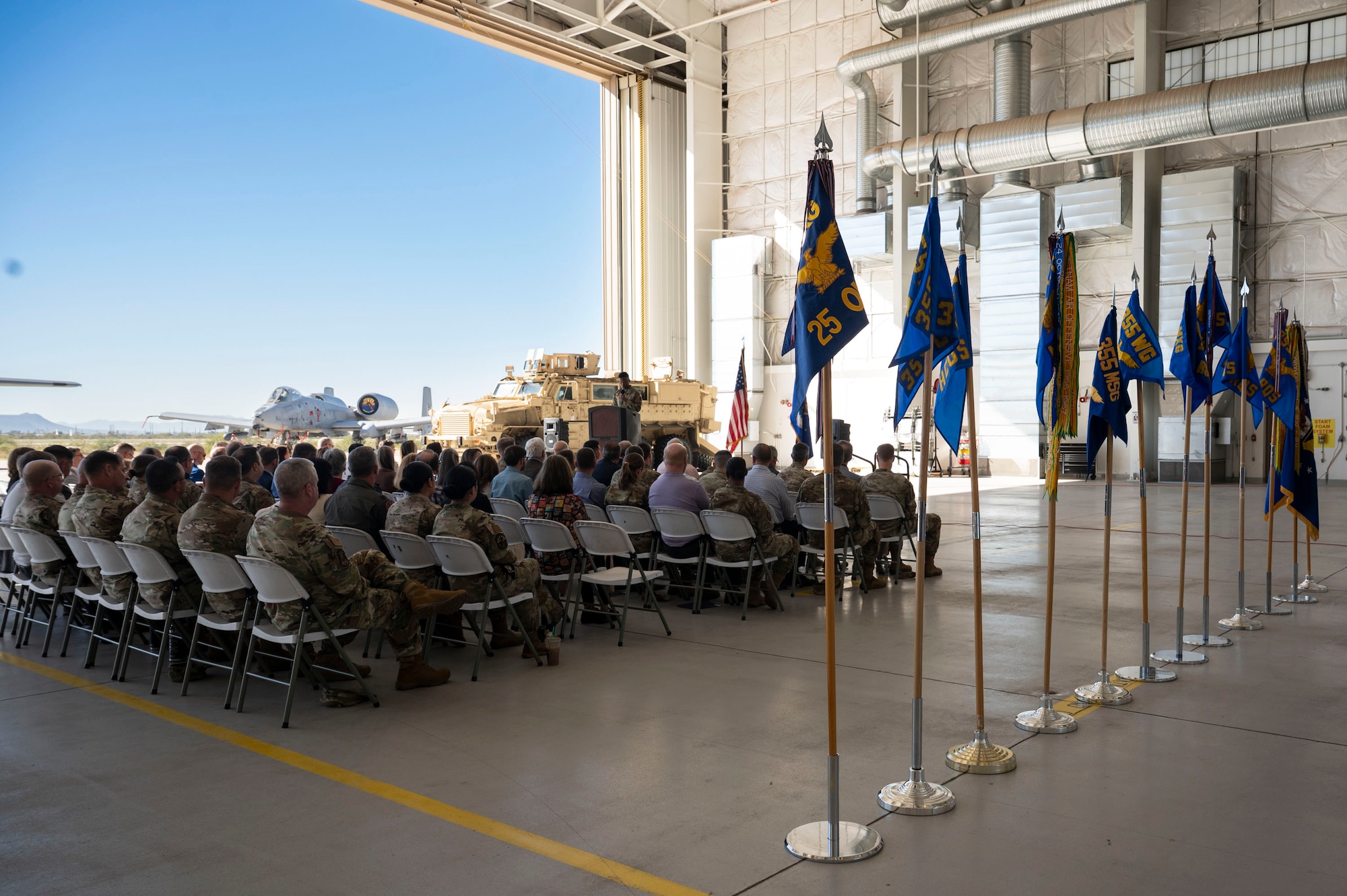 U.S. Air Force Airmen and Tucson community members attend an honorary change of command ceremony at Davis-Monthan Air Force Base, Arizona, Dec. 8, 2025. The ceremony celebrated the transfer of leadership within the Honorary Commander Program, highlighting the strong partnership between the base and the local community. (U.S. Air Force photo by Airman 1st Class Samantha Melecio)