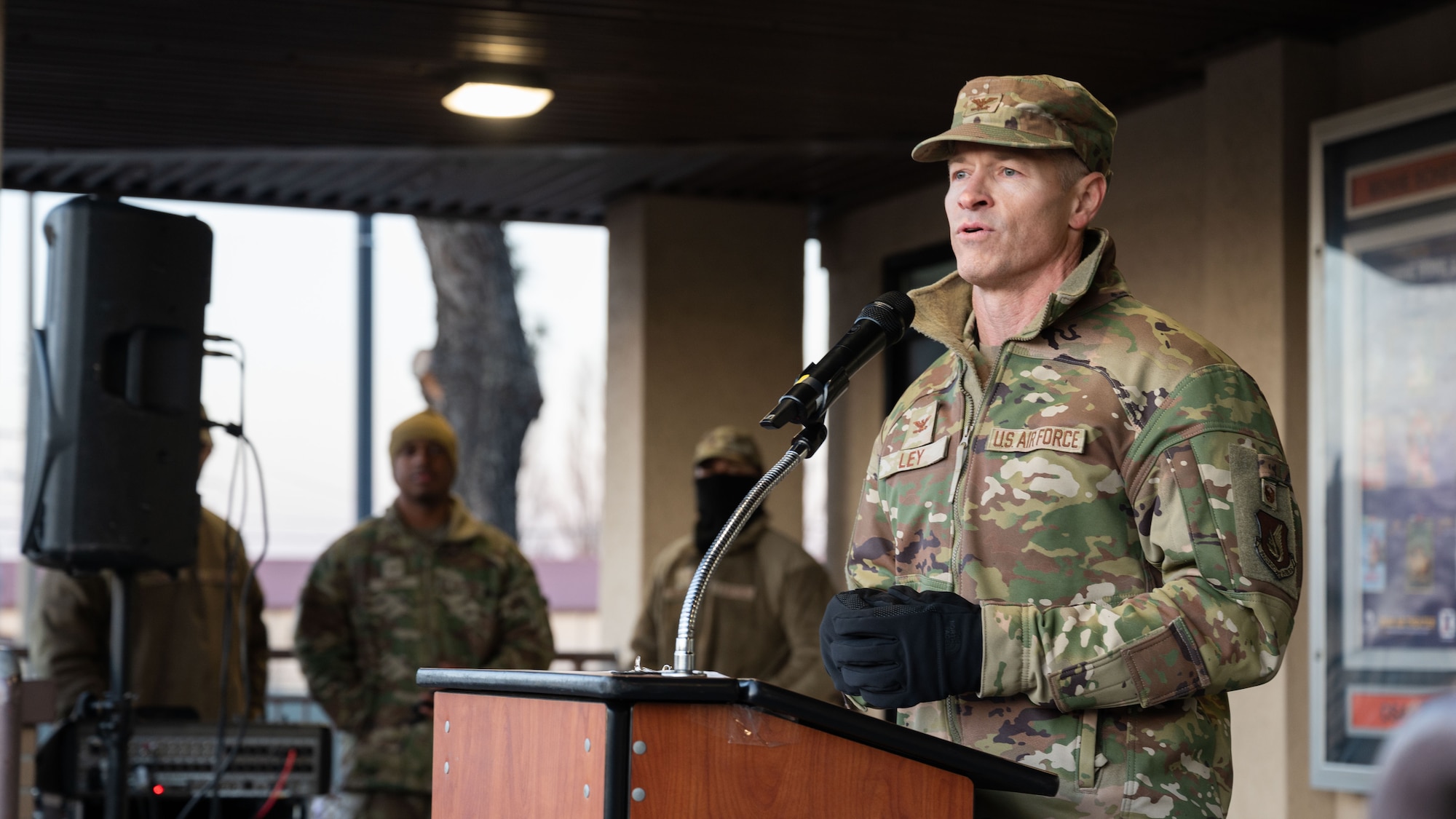 U.S. Air Force Col. Ryan Ley, 51st Fighter Wing commander, gives opening remarks during the Christmas Tree Lighting Ceremony at Osan Air Base, Republic of Korea, Dec. 5, 2025. The gathering provided Airmen and families an opportunity to reconnect, celebrate and support one another during the holiday season. (U.S. Air Force photo by Senior Airman Rome Bowermaster)