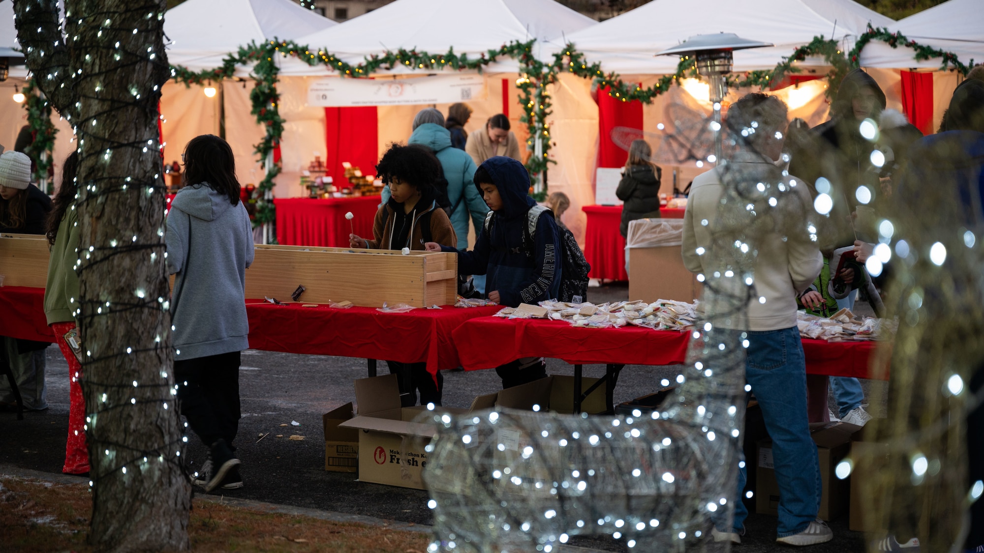 Members of the Osan community take part in a Winter Wonderland event hosted by the 51st Force Support Squadron at Osan Air Base, Republic of Korea, Dec. 5, 2025. The event offered a familiar holiday tradition far from home, helping build connections and support among the Osan community. (U.S. Air Force photo by Senior Airman Rome Bowermaster)