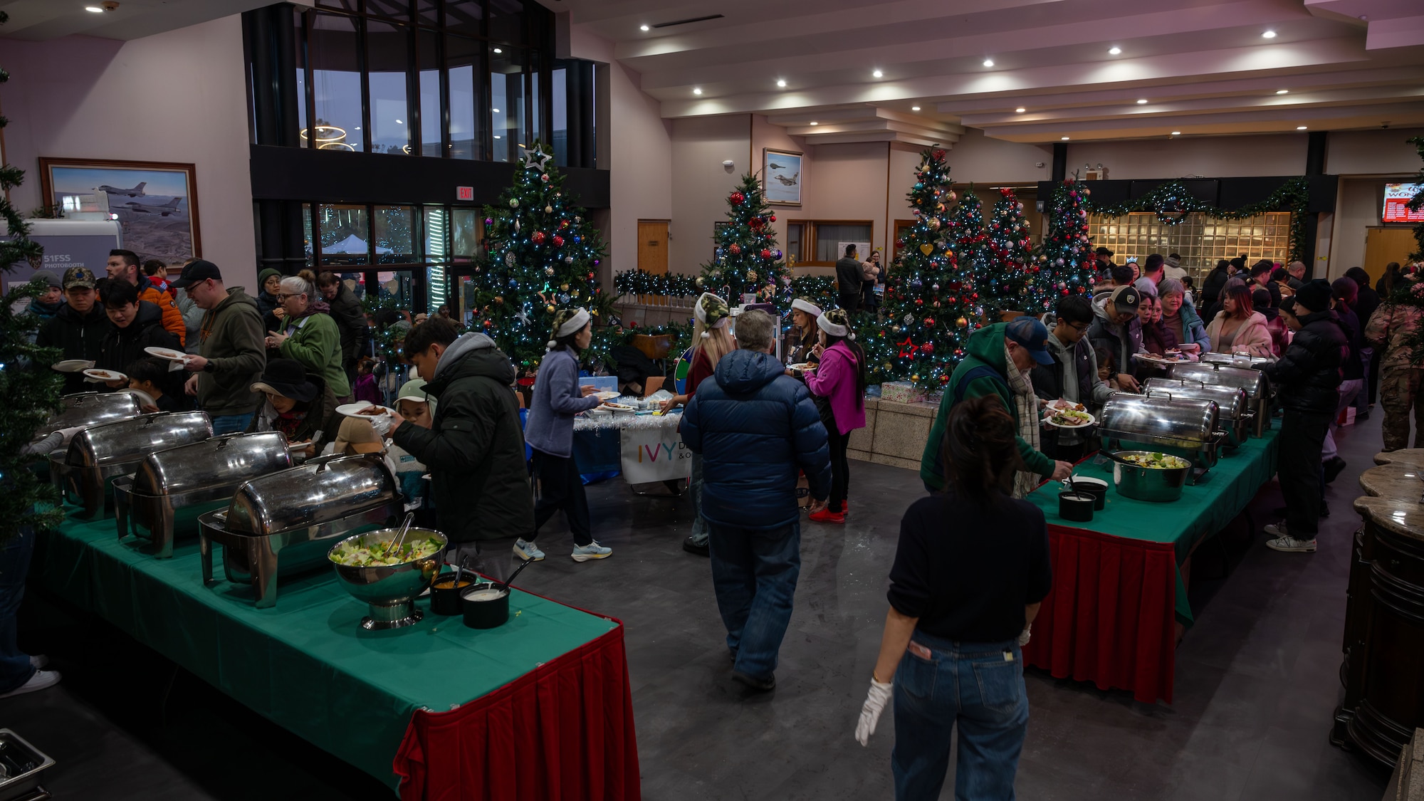 Members of the Osan community gather during the Winter Wonderland event hosted by the 51st Force Support Squadron at Osan Air Base, Republic of Korea, Dec. 5, 2025. The event offered a familiar holiday tradition far from home, helping build connection and support among the Osan community. (U.S. Air Force photo by Senior Airman Rome Bowermaster)