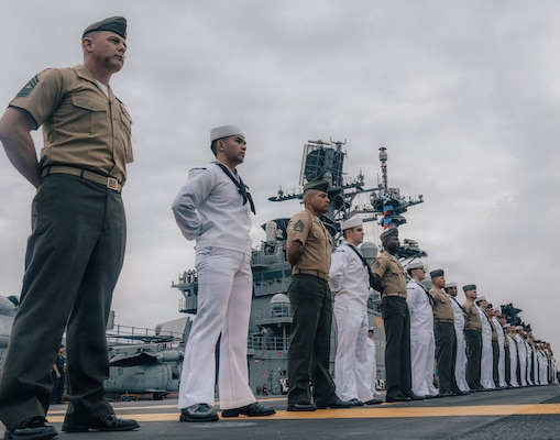 U.S. Marines and Sailors with the Tripoli Expeditionary Strike Group, man the rails as the forward-deployed amphibious assault ship USS Tripoli (LHA 7) arrives in Da Nang, Vietnam, Dec. 08, 2025.