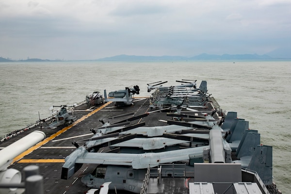 America-class amphibious assault ship USS Tripoli (LHA 7) pulls in to Da Nang, Vietnam for a port visit, Dec. 8, 2025.