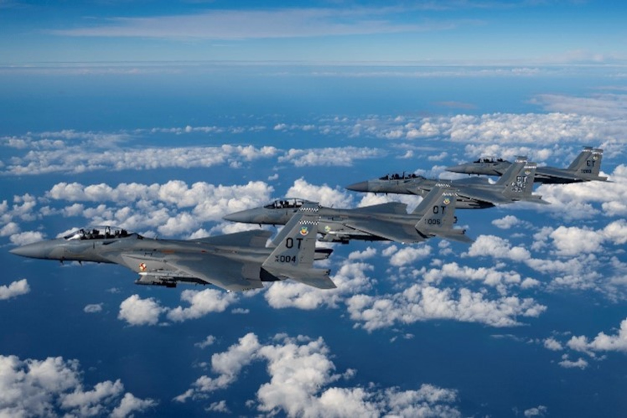 A formation of four U.S. Air Force F-15EX Eagle II fighter jets, assigned to Eglin Air Force Base, Florida, fly over the Gulf of America, Nov. 21, 2025. Secretary of the Air Force Troy Meink flew in the backseat of the lead jet as part of his visit to Eglin AFB. The flight oriented Meink to F-15EX tactics, techniques and procedures being developed and advanced by the 53d Wing to include weapons capacity, next-gen survivability, and next-generation radars, sensors and networking capabilities. (U.S. Air Force photo by Staff Sgt. Blake Wiles)