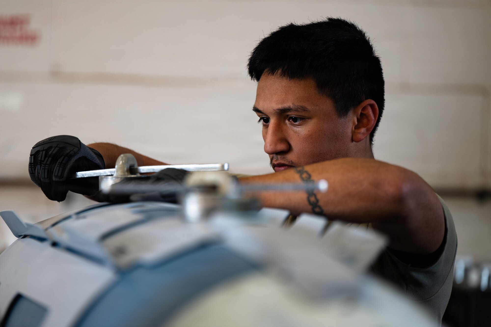 U.S. Air Force Airman First Class Aidan Garcia, 7th Munitions Squadron conventional maintenance technician, aligns strakes on a Guided Bomb Unit-31 during munitions build training at Dyess Air Force Base, Texas, Sept. 15, 2025. The 7th MUNS is responsible for storing, maintaining and delivery of quality munitions, and maintaining munitions release systems assuring mission readiness for the 7th Bomb Wing. (U.S. Air Force photo by Senior Airman Jade M. Caldwell)