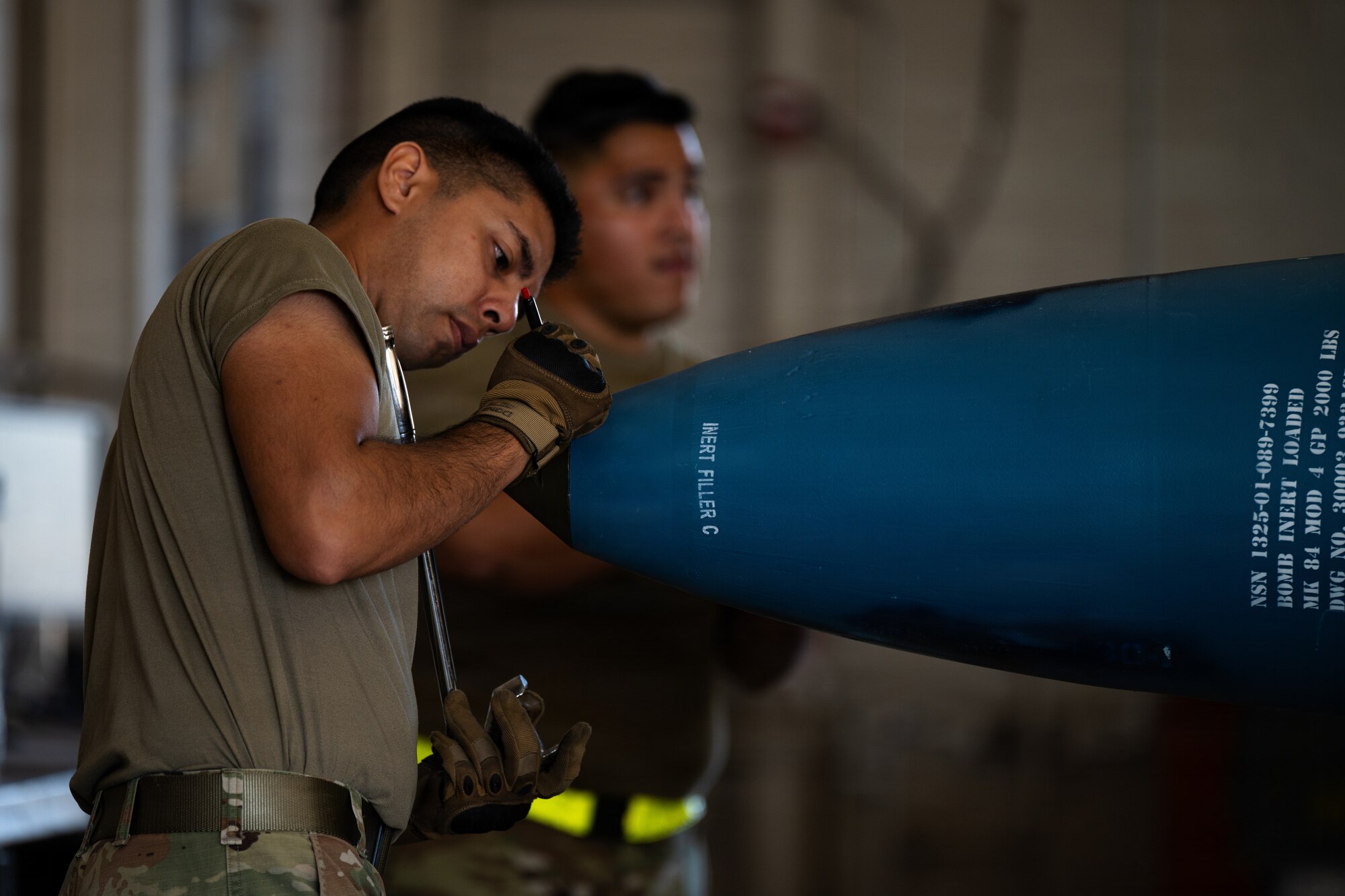 U.S. Air Force Senior Airman David Dones, 7th Munitions Squadron conventional maintenance crew chief, tightens a nose plug on a Guided Bomb Unit-31 at Dyess Air Force Base, Texas, Sept. 15, 2025. The 7th MUNS is responsible for storing, maintaining and delivery of quality munitions, and maintaining munitions release systems assuring mission readiness for the 7th Bomb Wing. (U.S. Air Force photo by Senior Airman Jade M. Caldwell)