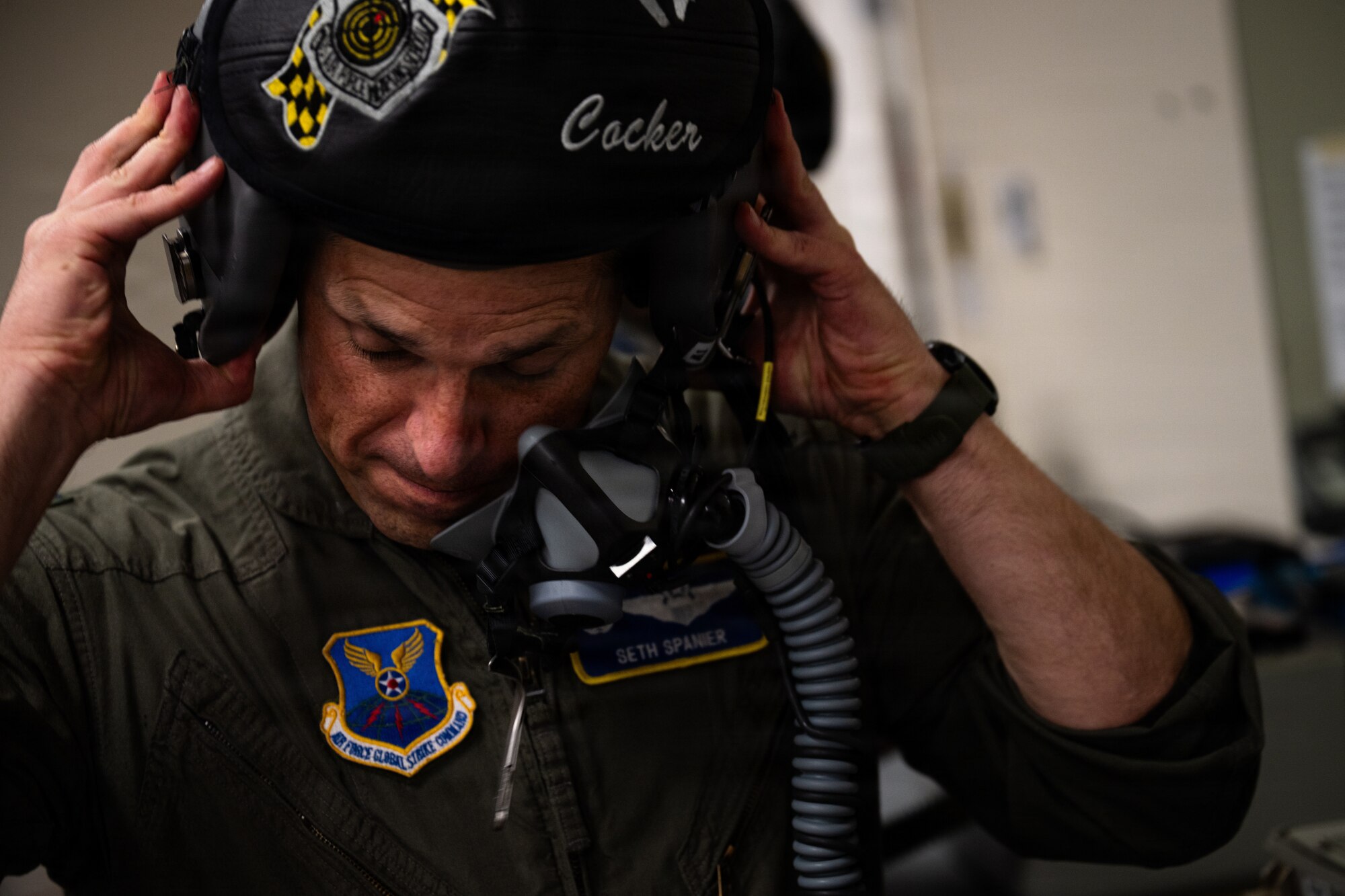 U.S. Air Force Col. Seth Spanier, 7th Bomb Wing commander and B-1B Lancer pilot, dons his flight helmet before a routine training flight at Dyess Air Force Base, Texas, Sept. 15, 2025. Spanier is a command pilot with over 3,260 flight hours. (U.S. Air Force photo by Senior Airman Jade M. Caldwell)