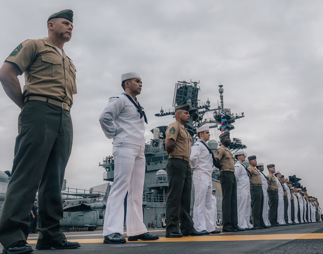 U.S. Marines and Sailors with the Tripoli Expeditionary Strike Group, man the rails as the forward-deployed amphibious assault ship USS Tripoli (LHA 7) arrives in Da Nang, Vietnam, Dec. 08, 2025. The USS Tripoli (LHA 7); USS Robert Smalls (CG 62); and elements of the 31st Marine Expeditionary Unit, Amphibious Squadron (PHIBRON) 11 and Commander, Task Force (CTF) 76 are in Da Nang, Vietnam, for a scheduled port visit. U.S. 7th Fleet is the U.S. Navy’s largest forward-deployed numbered fleet, routinely interacts and operates with allies and partners in preserving a free and open Indo-Pacific region. (U.S. Marine Corps photo by Lance Cpl. Raul Sotovilla)