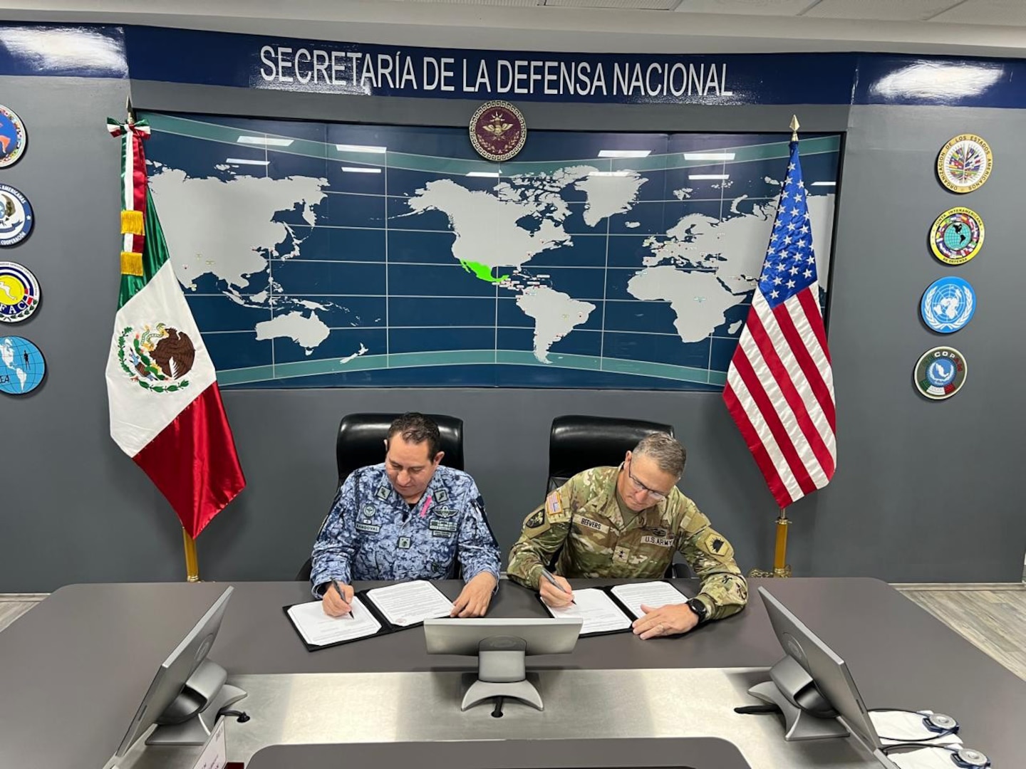 U.S. Army Maj. Gen. Matthew P. Beevers and Maj. Gen. Javier Sandoval Duenas, deputy chief of military doctrine of the National Defense Joint Headquarters Staff, or EMCDN, sign a letter of intent formalizing the agreement for Mexico to join the Department of War National Guard Bureau's State Partnership Program with the California National Guard.