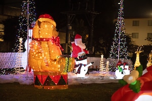 Christmas decorations are illuminated at night.