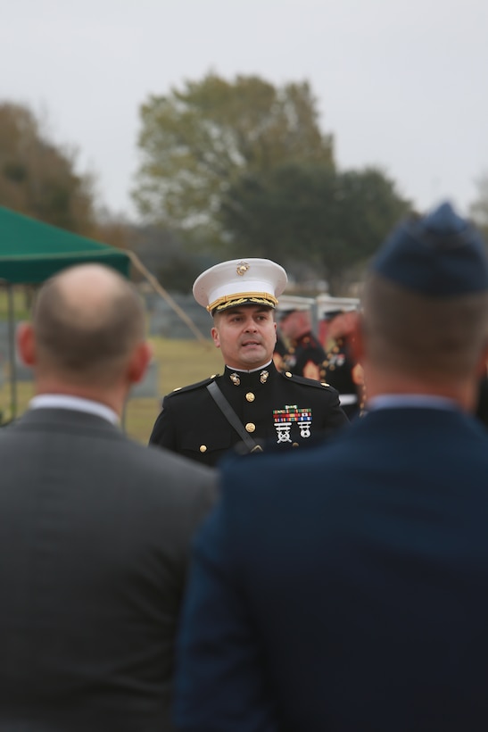 U.S. Marine Corps Maj. Mark Gutierrez honors deceased Lt. Gen. John H. Miller (ret.) at Aggie Field of Honor and Memorial Cemetery, College Station, Texas, Dec. 5, 2025. Lt. Gen. Miller (ret.), highly decorated Marine, served loyally for nearly four decades in the United States Marine Corps. He began his career in 1943, enlisting in the Marine Corps Reserve, attended and commissioned as a Marine Corps officer out of Texas A&M and retired as a Lt. Gen., serving in three different wars. He served valiantly earning a Bronze Star Medal and the Purple Heart Medal among other military awards. (U.S. Marine Corps photo by LCpl. Donnell Brown)