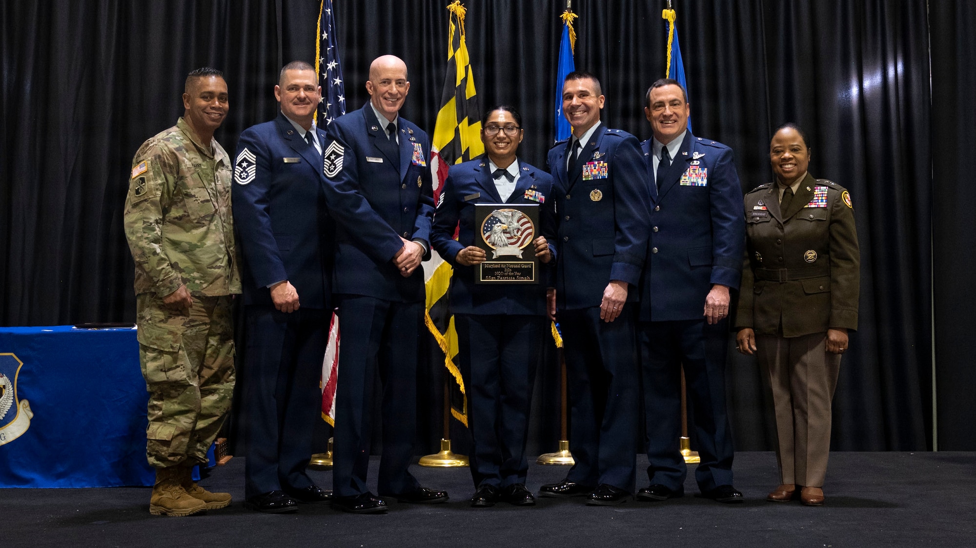 Maryland Air National Guard Staff Sgt. Patricia Singh, a malware analyst and digital exploitation analyst for the 175th Cyberspace Operations Squadron, non-commissioned officer of the year, receives a plaque during the 175th Wing’s Airman Recognition Ceremony at Warfield Air National Guard Base at Martin State Airport, Maryland, December 7, 2025. The annual event honors the wonderful achievements of the Maryland National Guard and recognizes the wing’s outstanding airmen of the year. (U.S. Air National Guard Photo by Staff Sgt. Alexandra Huettner)