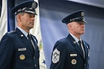 Chief Master Sgt. of the Air Force David Wolfe and Air Force Chief of Staff Gen. Ken Wilsbach stand during Wolfe’s assumption of responsibility ceremony on Joint Base Andrews, Md., Dec. 8, 2025. Wolfe succeeded Chief Master Sgt. of the Air Force David Flosi as the 21st CMSAF. (U.S. Air Force photo by Eric Dietrich)