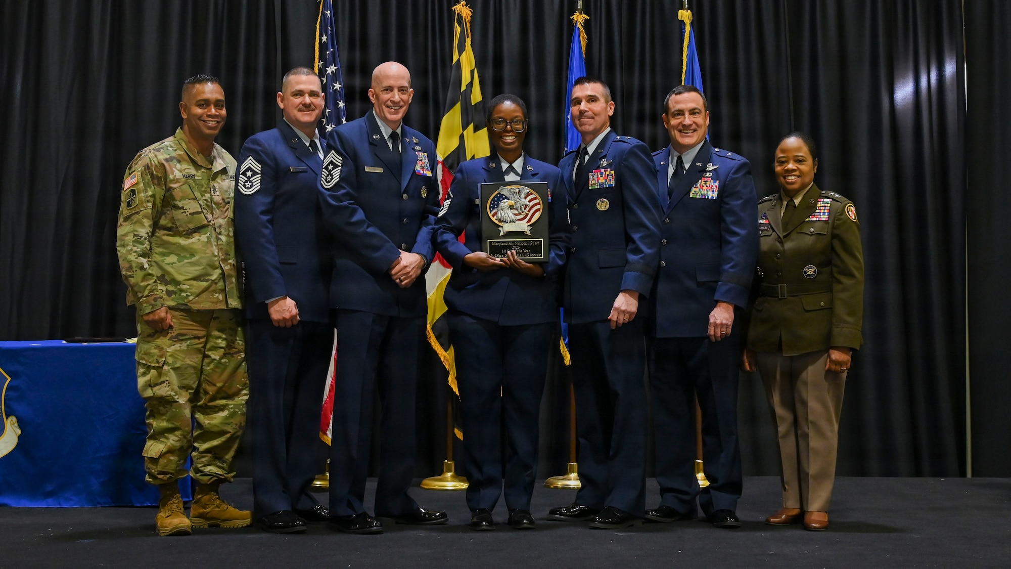 Maryland Air National Guard Master Sgt. Samillia Glover, first sergeant for the 175th Logistics Readiness Squadron, outstanding airman of the year for first sergeant, receives a plaque during the 175th’s Wing Airman Recognition Ceremony at Warfield Air National Guard Base at Martin State Airport, Maryland, December 7, 2025. The annual event honors the wonderful achievements of the Maryland National Guard and recognizes the wing’s outstanding airmen of the year. (U.S. Air National Guard Photo by Staff Sgt. Alexandra Huettner)