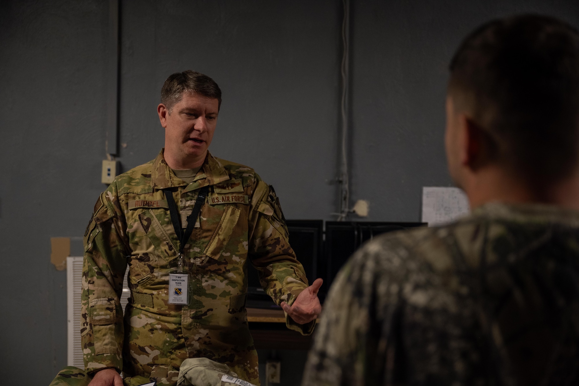 U.S. Air Force Lt. Col. Nick Ruppel, 7th Medical Group chief of aerospace medicine, briefs Airmen on active shooter procedures during an exercise at Dyess Air Force Base, Texas, Dec. 3, 2025. Wing Inspection Team members evaluated Airmen on their response to various scenarios throughout the exercise. (U.S. Air Force photo by Airman 1st Class Adrien Tran)